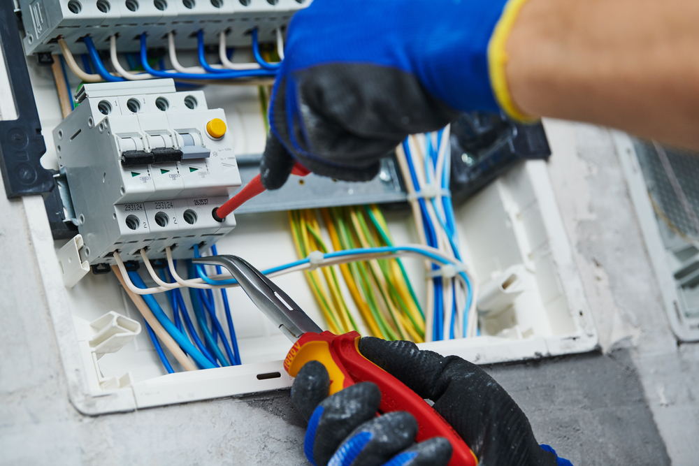 AC-tech-gloved-hands-working-on-AC-wires